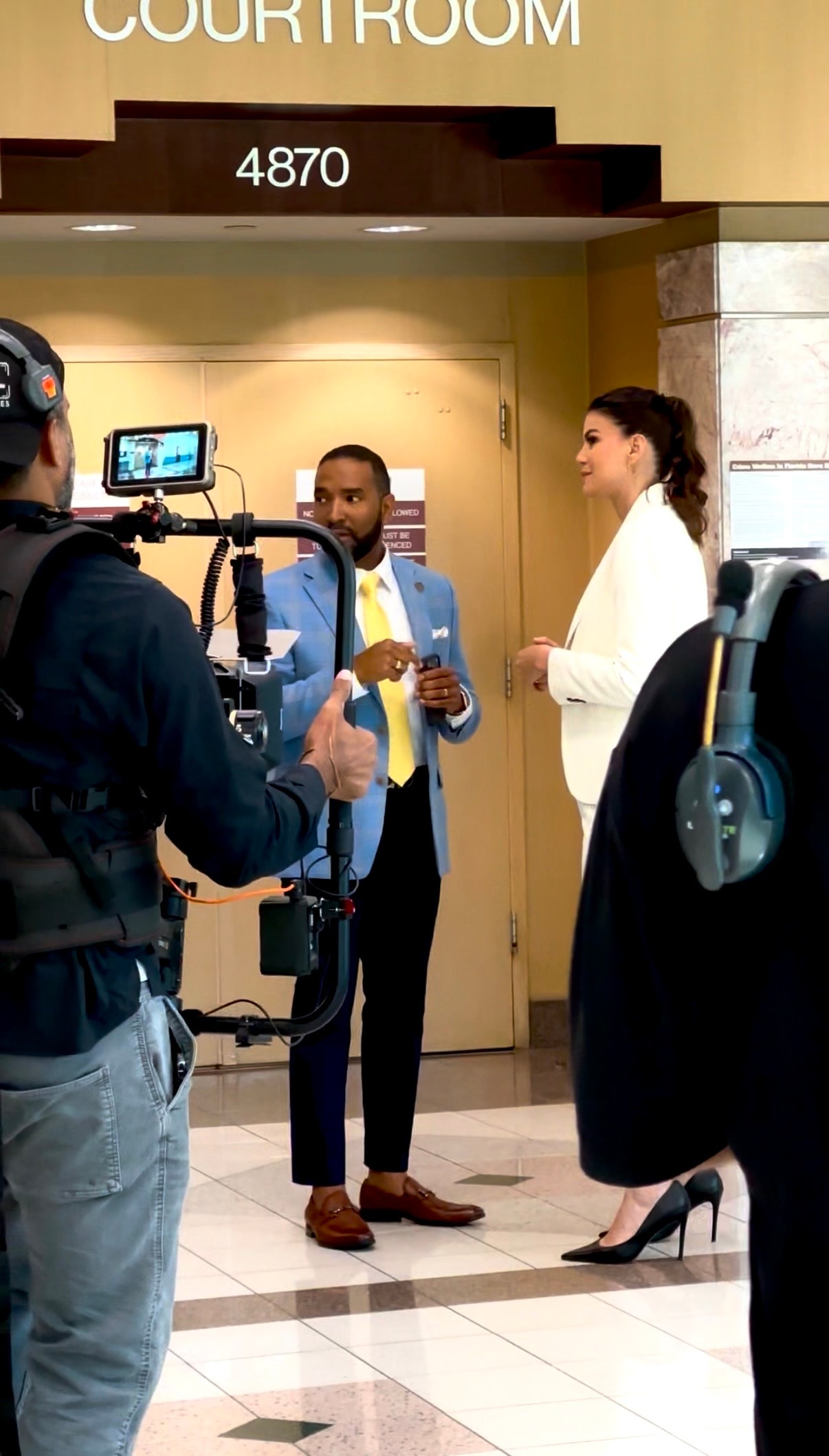 Attorney JeanCarlos Medina being interviewed outside Courtroom 4870